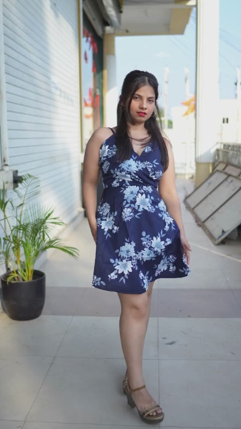 Elevate your style with our Navy Blue Polka A-line Dress. This blue crepe dress, featuring a playful polka print, A-line silhouette, and sleeveless design with shoulder straps, is an ideal choice for Western wear. Explore mini dresses online in India for trendy options. 