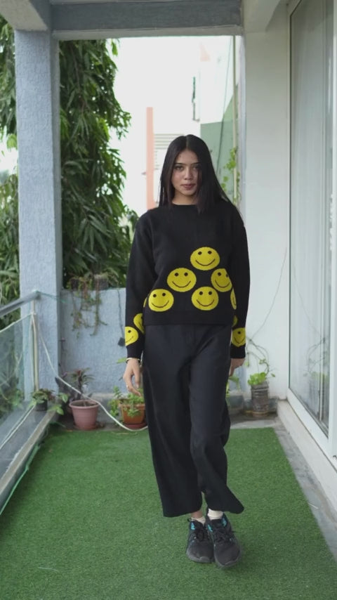 Elevate your style with Wyshlist's Smilie Oversize Pullover. This black printed wool pullover with a round neck and long sleeves is perfect for casual occasions. Shop now for trendy Women's Sweaters and Pullovers, ideal for Winter Wear. Find affordable and comfortable options for a standout winter wardrobe.