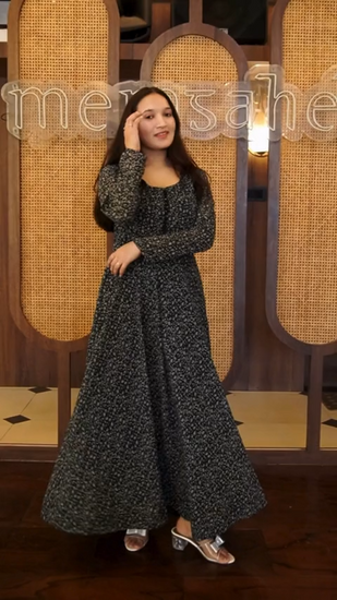 Elevate your style with our Midnight Paisley Flare Gown Dress. This black paisley printed maxi dress features a round neck, full sleeves, and intricate bead detailing on the front side. Made of georgette, it's perfect for any occasion. Shop now on Wyshlist for women's maxi dresses. Find your perfect fit today!